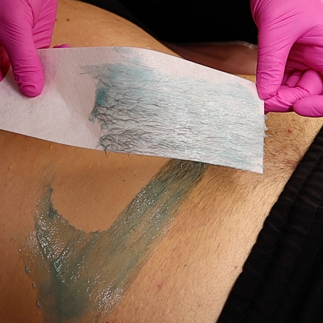 Back wax with hair on wax strip using lagoon strip wax. 