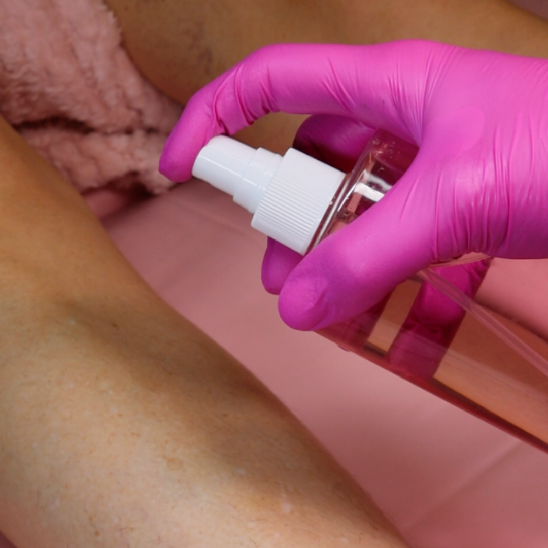 Pinkfishes Pre-Waxing Cleansing Spray being used.