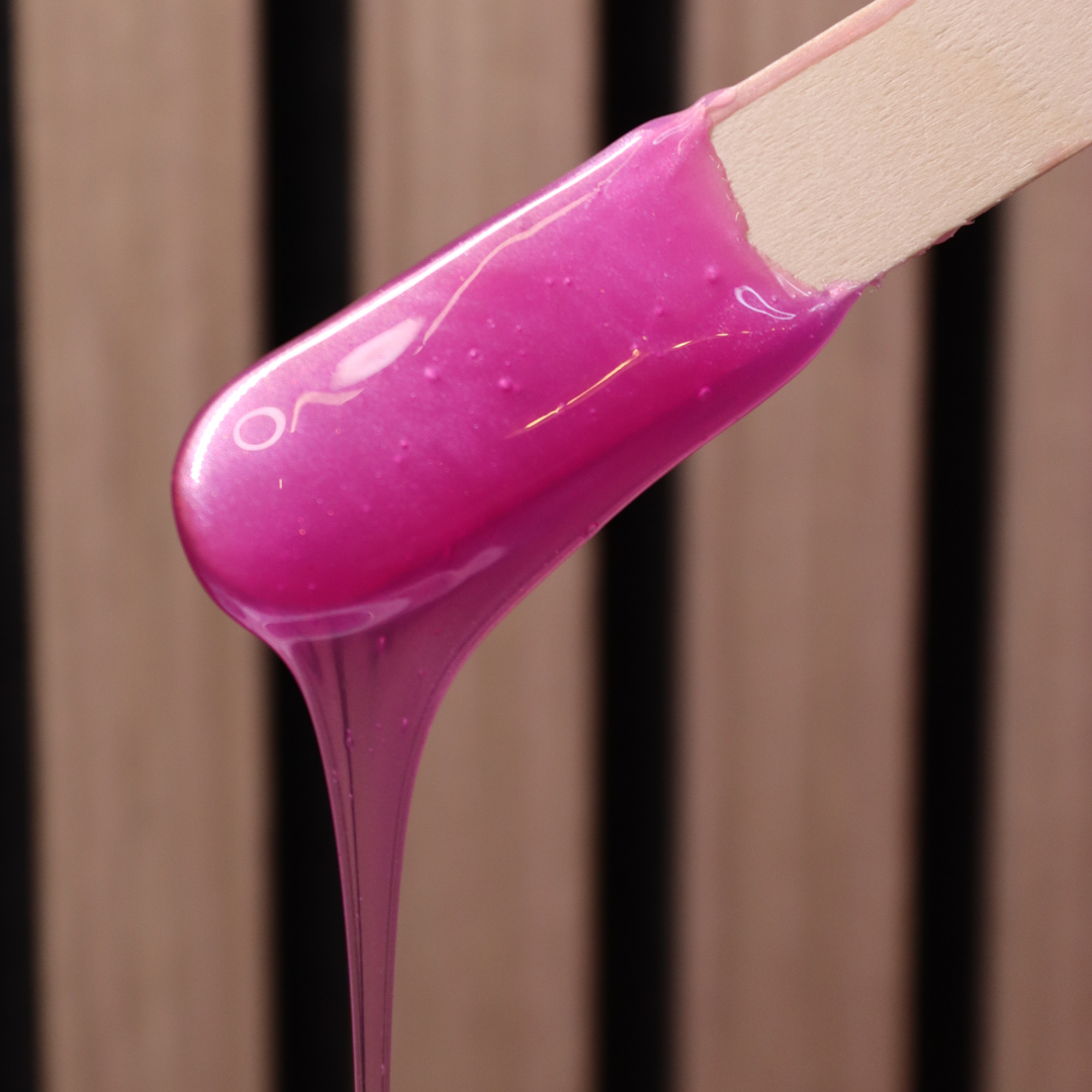 Siren Wax dripping down on waxing spatula. 